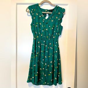 Emerald green print fit and flare dress with scallop detailing